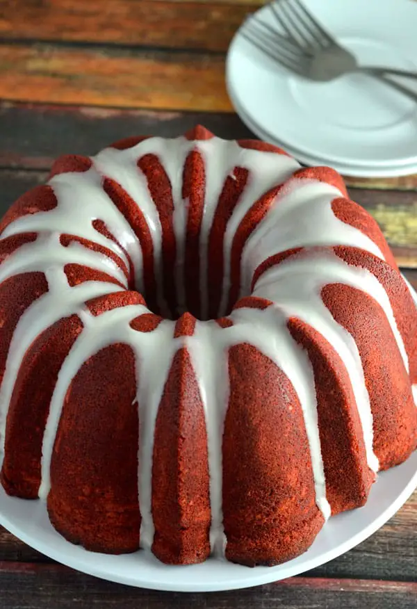 Red Velvet Pound Cake- This Red Velvet Pound cake is moist, flavorful, and delicious. Each bite taken will force your taste buds to go wild! www.domesticdee.com