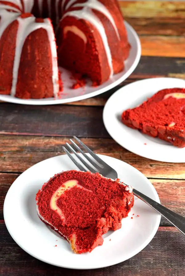 Red Velvet Pound Cake- This Red Velvet Pound cake is moist, flavorful, and delicious. Each bite taken will force your taste buds to go wild! www.domesticdee.com