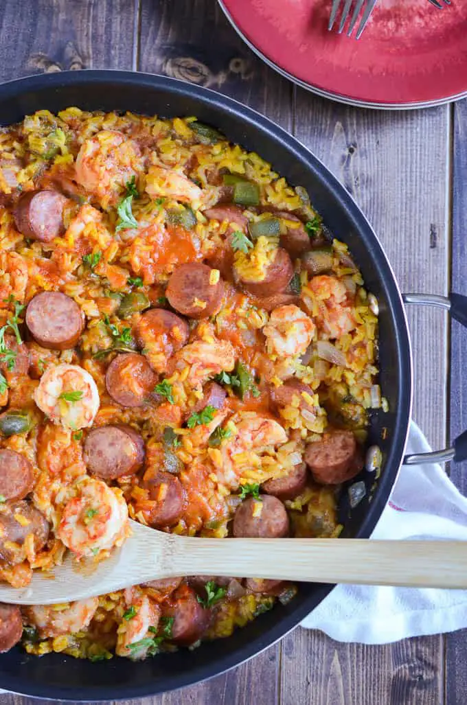 Easy Jambalaya-This easy jambalaya recipe is a classic dish of Louisiana. It contains turkey sausage, shrimp, and rice with a ton of flavor all while still being an easy jambalaya recipe to make for your family. www.domesticdee.com