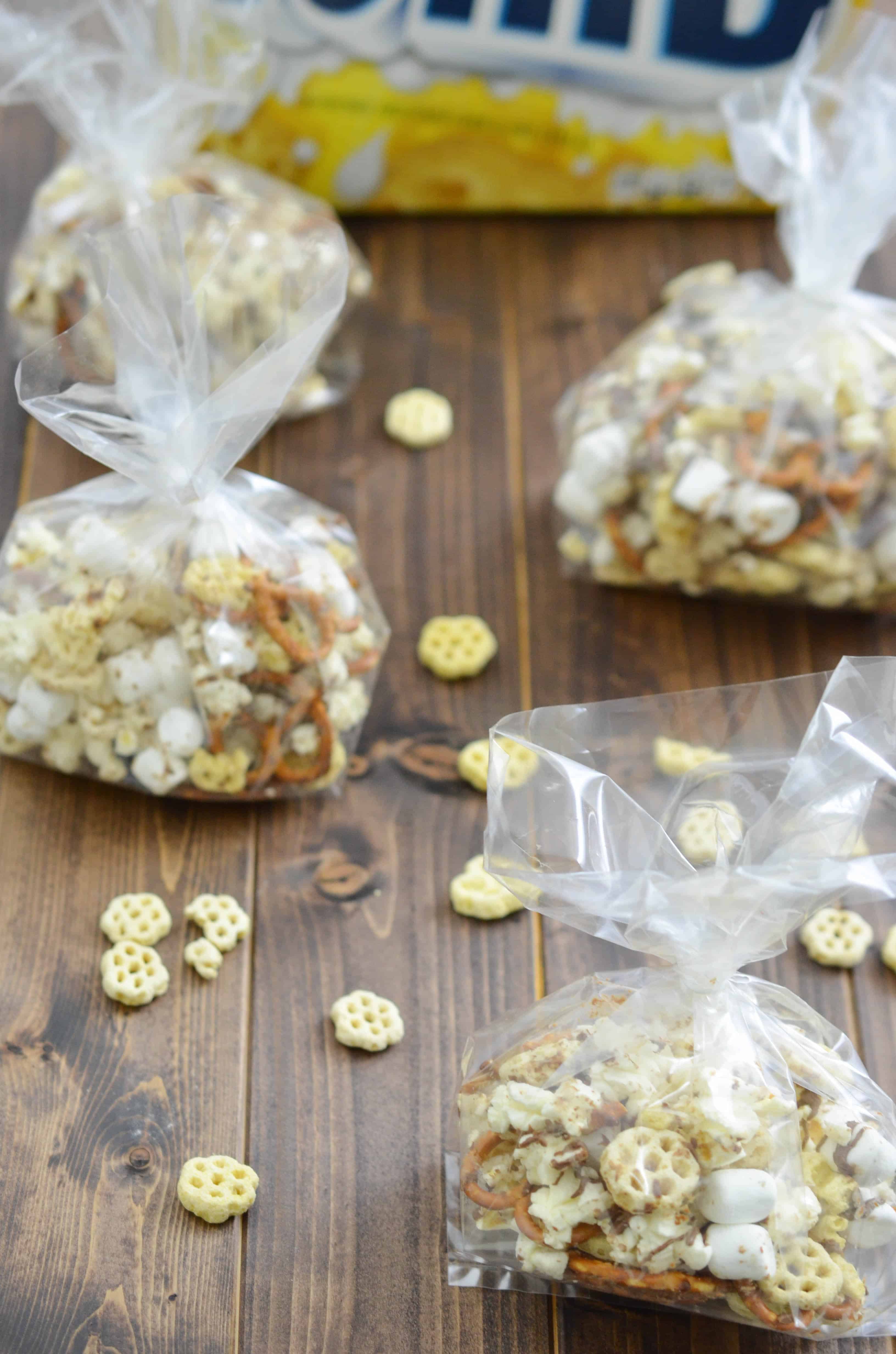 This snack mix recipe is made with a family favorite, Honeycomb cereal. This mix includes pretzels, popcorn, marshmallows, and is topped with a milk chocolate drizzle. A treat all kids will enjoy.