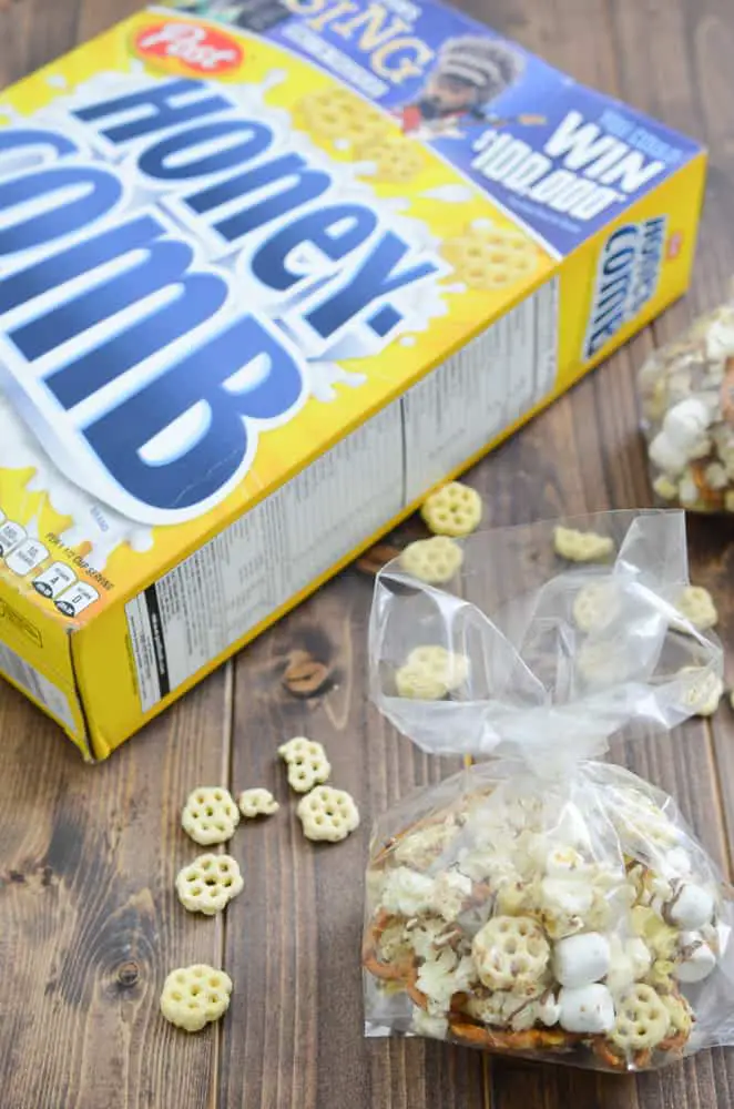 This snack mix recipe is made with a family favorite, Honeycomb cereal. This mix includes pretzels, popcorn, marshmallows, and is topped with a milk chocolate drizzle. A treat all kids will enjoy.