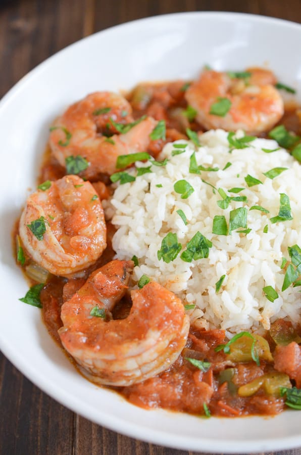 Easy Shrimp Creole Recipe- This easy shrimp creole recipe has jumbo shrimp, simmered in creole tomato sauce served over a steamy bed of rice. Can we say yummmm?