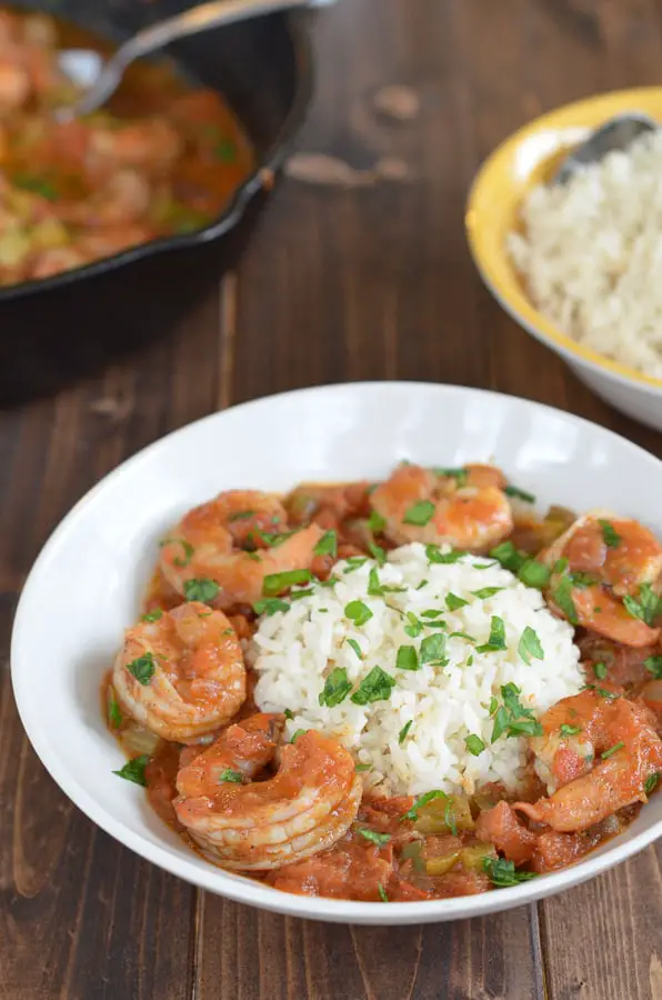 Easy Shrimp Creole Recipe- This easy shrimp creole recipe has jumbo shrimp, simmered in creole tomato sauce served over a steamy bed of rice. Can we say yummmm?