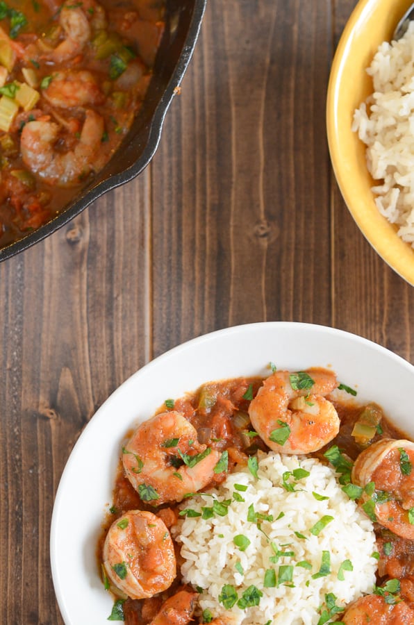 Easy Shrimp Creole Recipe- This easy shrimp creole recipe has jumbo shrimp, simmered in creole tomato sauce served over a steamy bed of rice. Can we say yummmm?