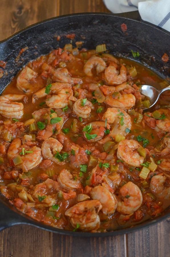 Easy Shrimp Creole Recipe- This easy shrimp creole recipe has jumbo shrimp, simmered in creole tomato sauce served over a steamy bed of rice. Can we say yummmm?