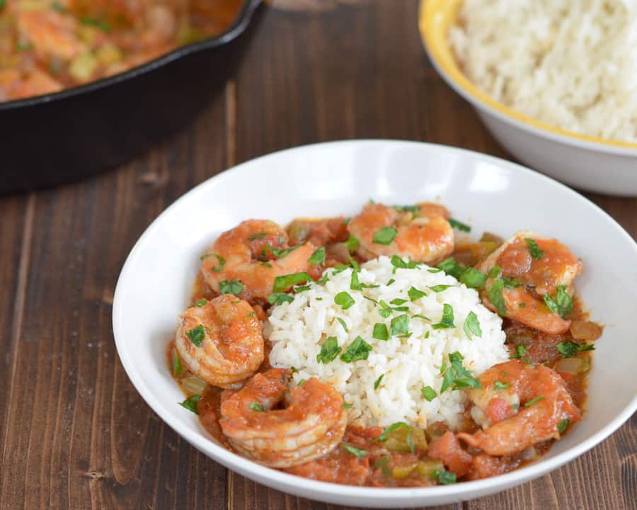 Easy Shrimp Creole Recipe- This easy shrimp creole recipe has jumbo shrimp, simmered in creole tomato sauce served over a steamy bed of rice. Can we say yummmm?