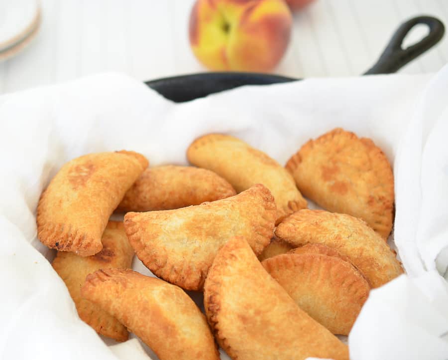 Fried Peach Pies-  These mini fried peach pies are crispy, flaky and delicious.They are filled with a cinnamon peach filling then fried to perfection. domesticdee.com