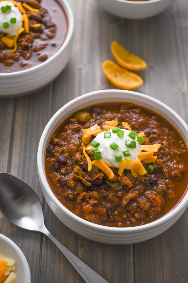 turkey chili with cheese and sour cream on top