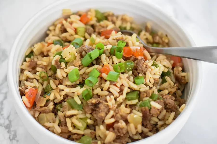 Vegan Dirty Rice- A flavorful vegan dirty rice recipe that cooks up in no time. It’s bursting with a delicious flavor you will forget it’s meatless. Plant-based ground protein, seasonings, vegetables, and rice makes this classic Southern comfort dish a recipe that you need to try!