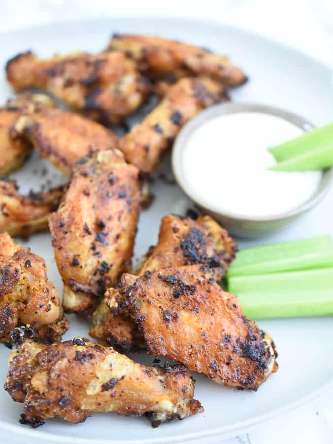 These Air Fryer Lemon Pepper Chicken Wings are juicy, flavorful and extra crispy! Putting these chicken wings in the air fryer is the easiest and best way to get crispy lemon pepper wings without all the grease! You’re going to love how succulent these wings are! #airfryer #chickenwings